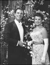 Bert Parks and Jacquelyn Mayer, Miss America 1963, posing for the camera.  Bert Parks was the television host from 1955-1979.
